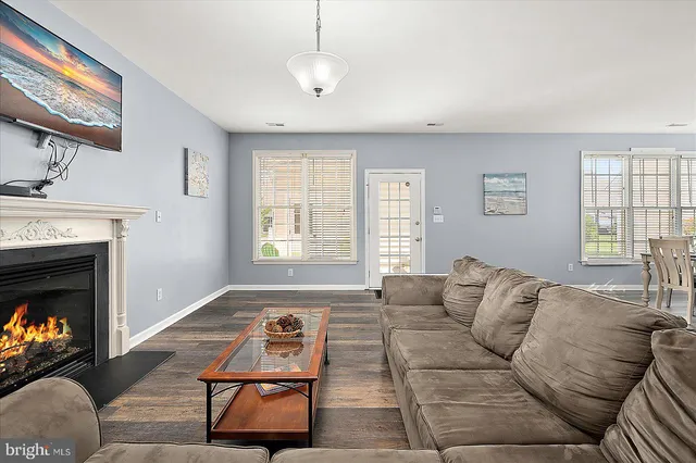 a view of a garden with wooden fence