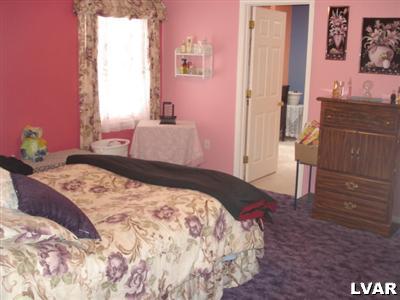2 County Park Road Gilbert, PA 18331 - Photo 8 of 10 a bedroom with a bed and a dresser