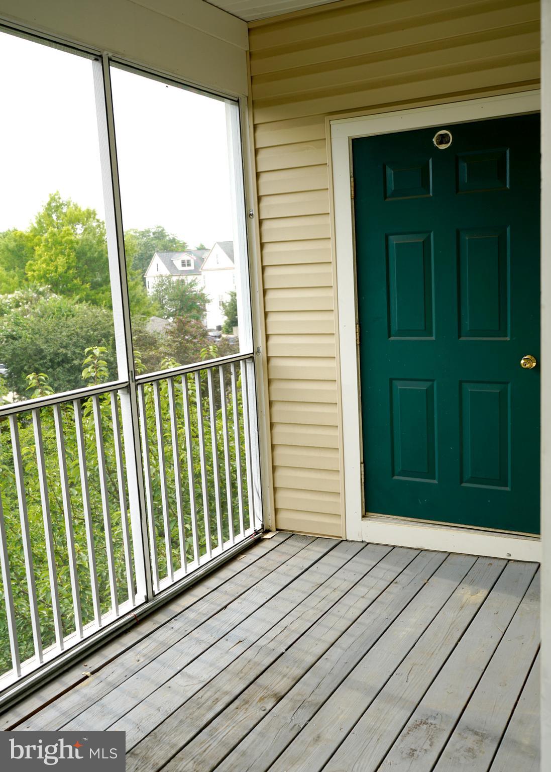 12004 Amber Ridge Circle, Unit B303 Germantown, MD 20876 - Photo 22 of 25 a view of wooden balcony