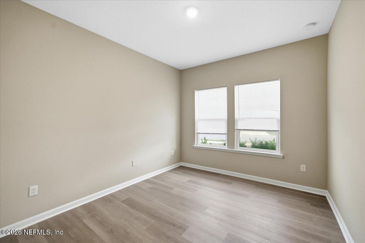 12032 Bridgehampton Road Jacksonville, FL 32218 - Photo 12 of 52 an empty room with a window