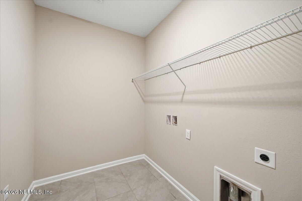 12032 Bridgehampton Road Jacksonville, FL 32218 - Photo 16 of 52 a view of storage and utility room with empty racks