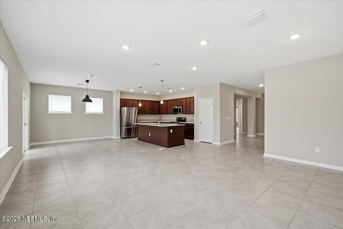 12032 Bridgehampton Road Jacksonville, FL 32218 - Photo 20 of 52 a living room with furniture and a couch
