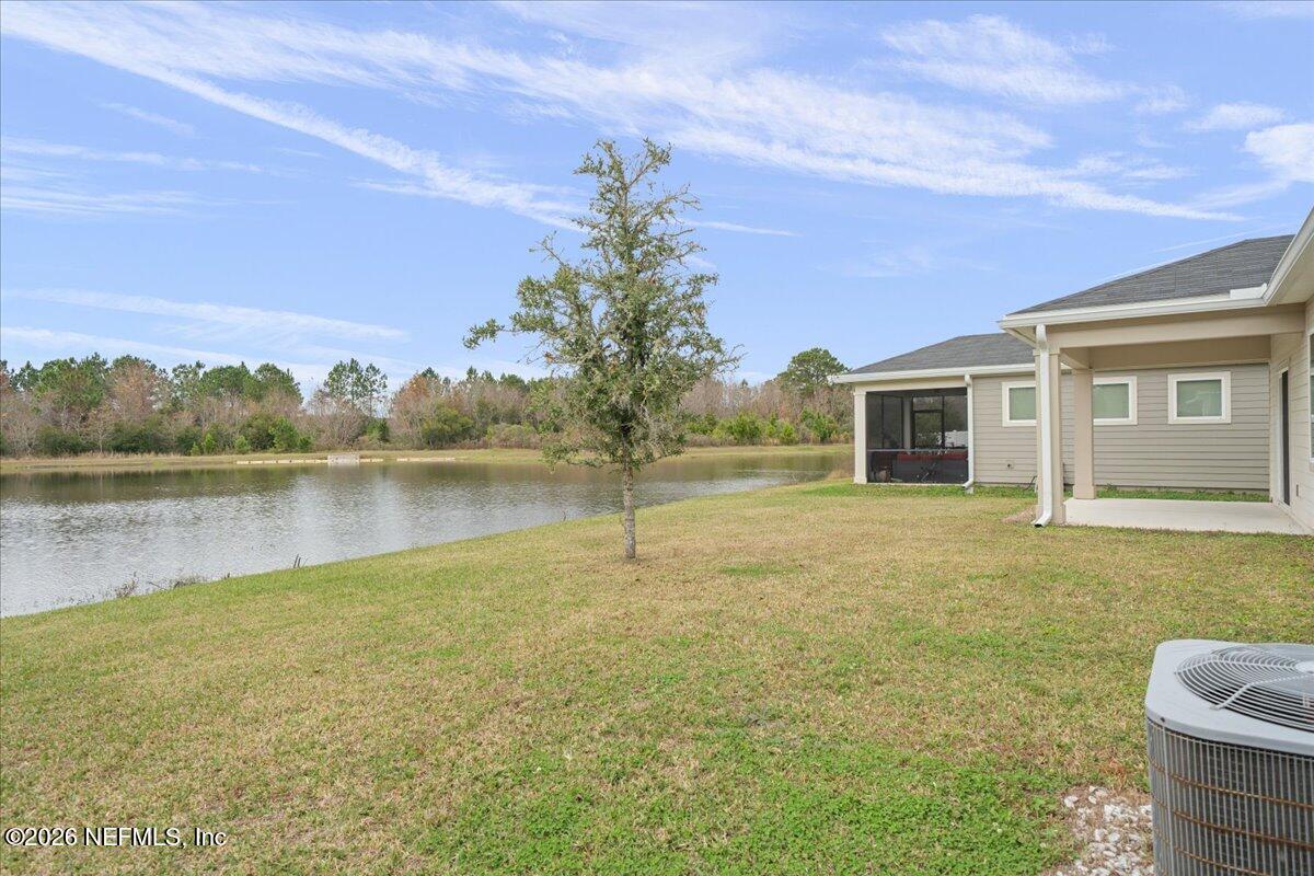 12032 Bridgehampton Road Jacksonville, FL 32218 - Photo 35 of 52 a house with lake view