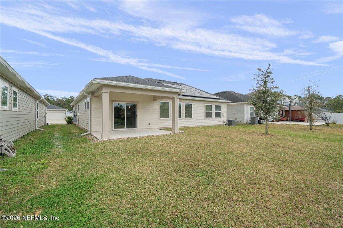 12032 Bridgehampton Road Jacksonville, FL 32218 - Photo 37 of 52 a front view of a house with a garden