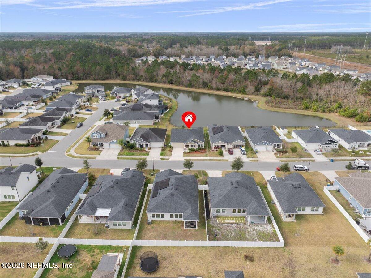 12032 Bridgehampton Road Jacksonville, FL 32218 - Photo 43 of 52 an aerial view of residential houses with outdoor space