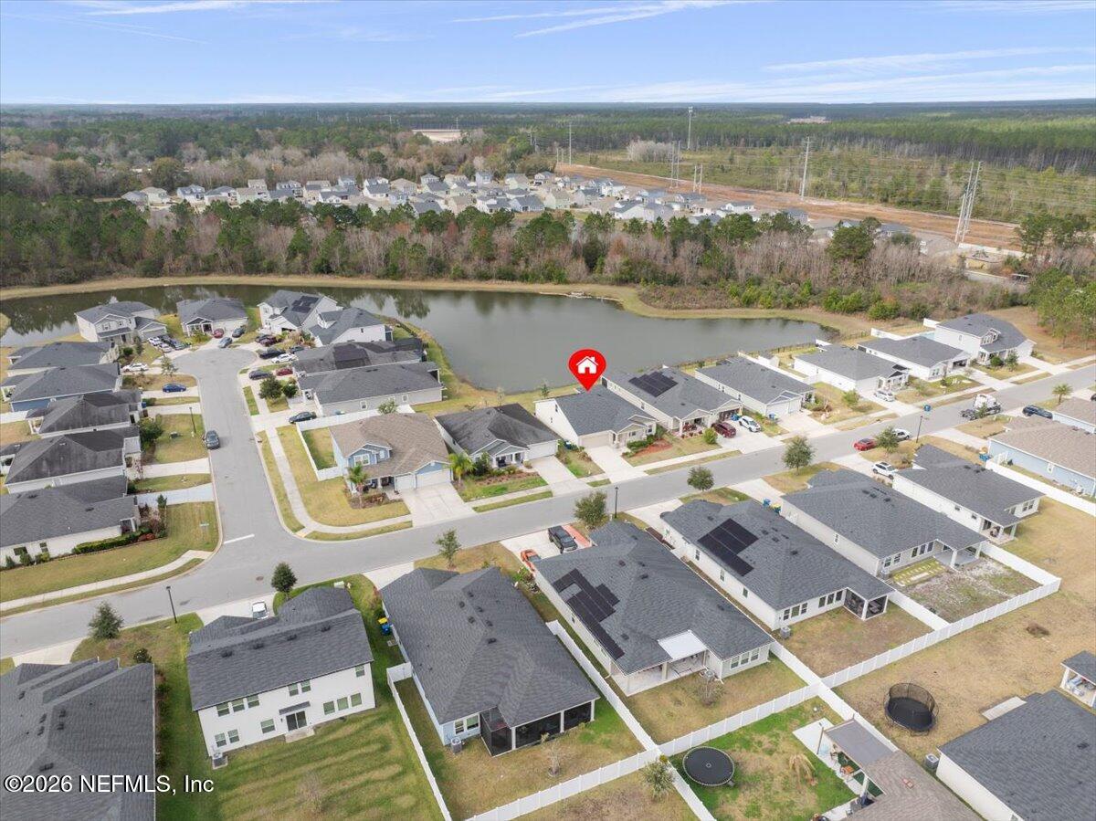 12032 Bridgehampton Road Jacksonville, FL 32218 - Photo 44 of 52 an aerial view of residential houses with outdoor space