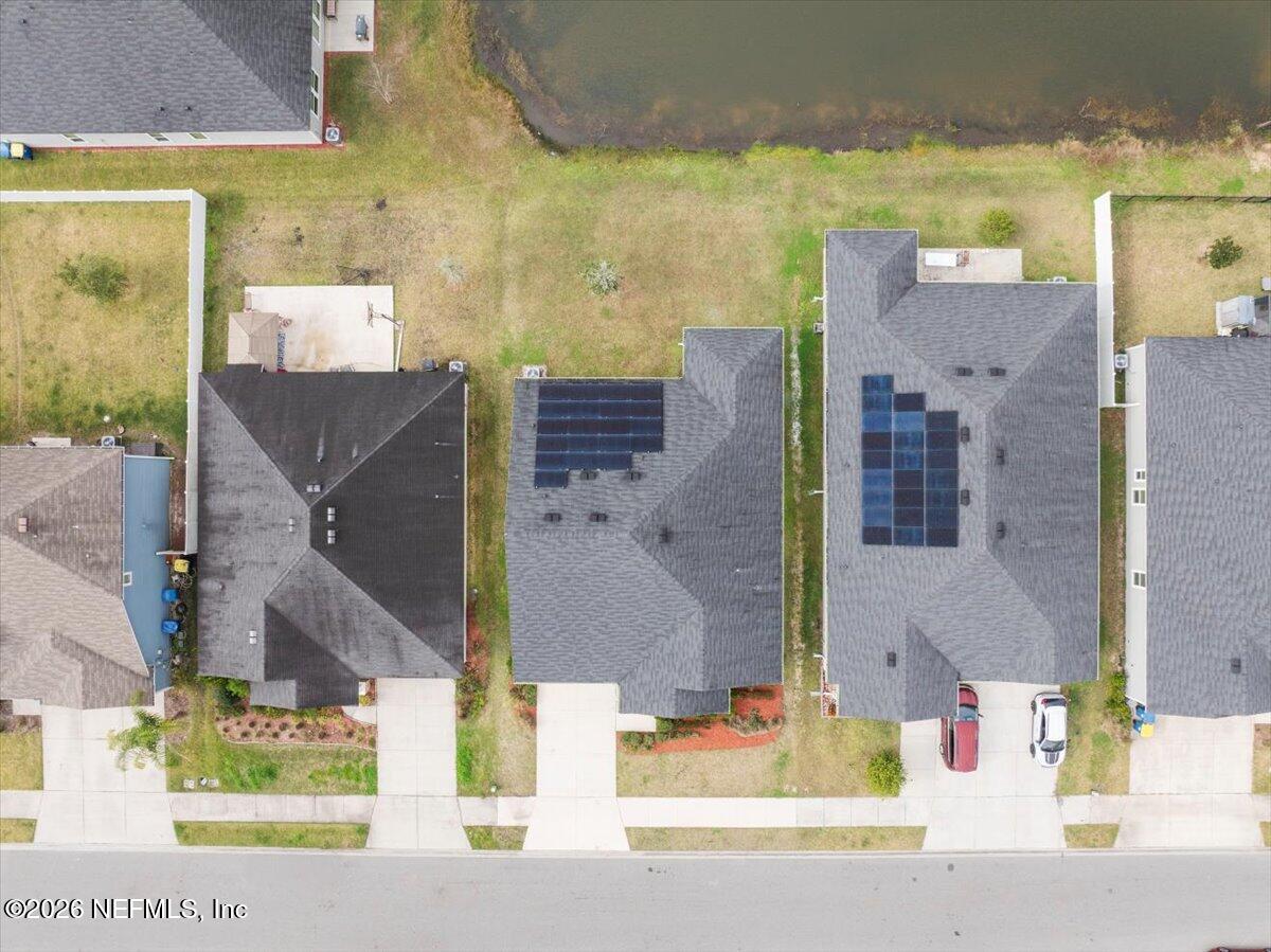 12032 Bridgehampton Road Jacksonville, FL 32218 - Photo 45 of 52 an aerial view of residential houses with outdoor space