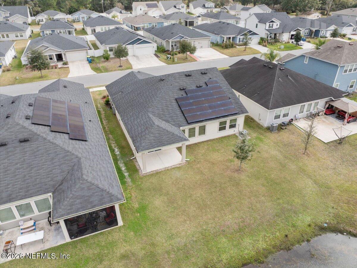 12032 Bridgehampton Road Jacksonville, FL 32218 - Photo 47 of 52 an aerial view of residential houses with outdoor space