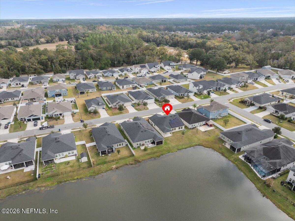 12032 Bridgehampton Road Jacksonville, FL 32218 - Photo 48 of 52 an aerial view of residential houses with outdoor space