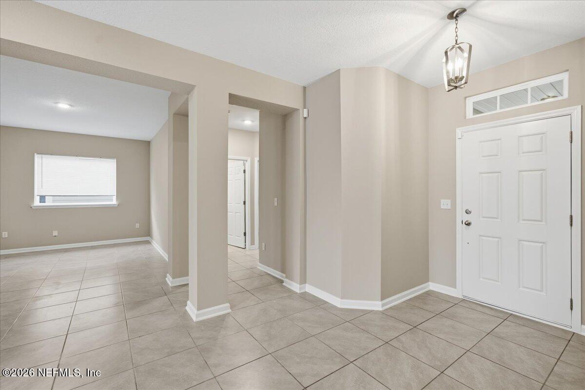 12032 Bridgehampton Road Jacksonville, FL 32218 - Photo 7 of 52 a view of an empty room and window