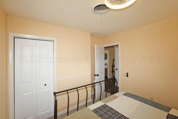 a bedroom with a bed and a table