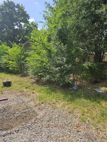 a view of a garden with an outdoor space