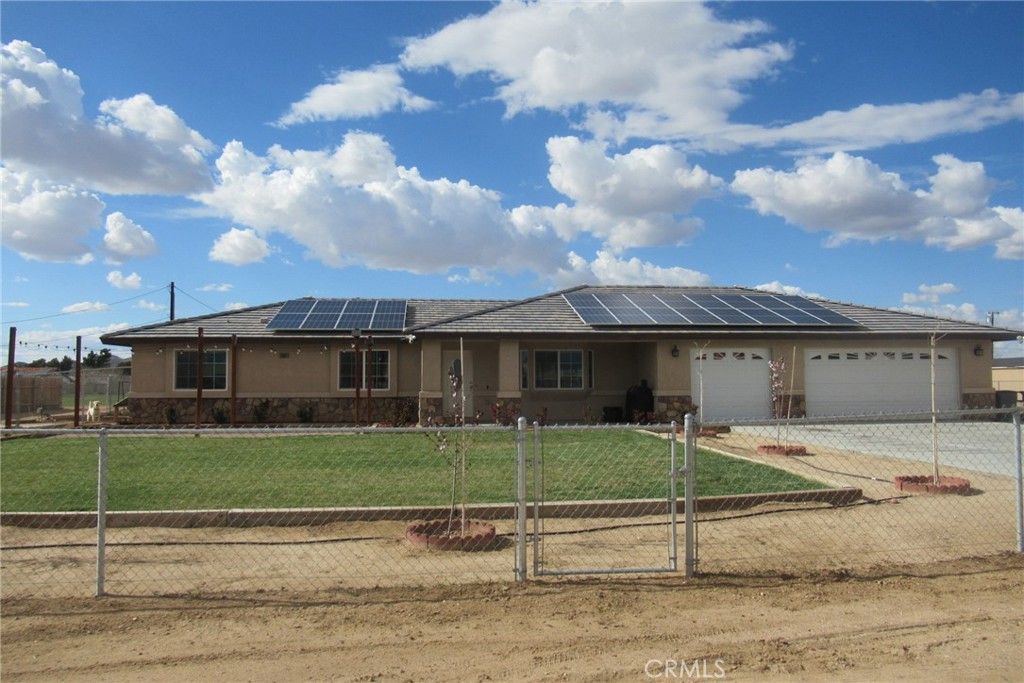 14984 Gayhead Road Apple Valley, CA 92307 - Photo 1 of 1 a view of a house next to a yard