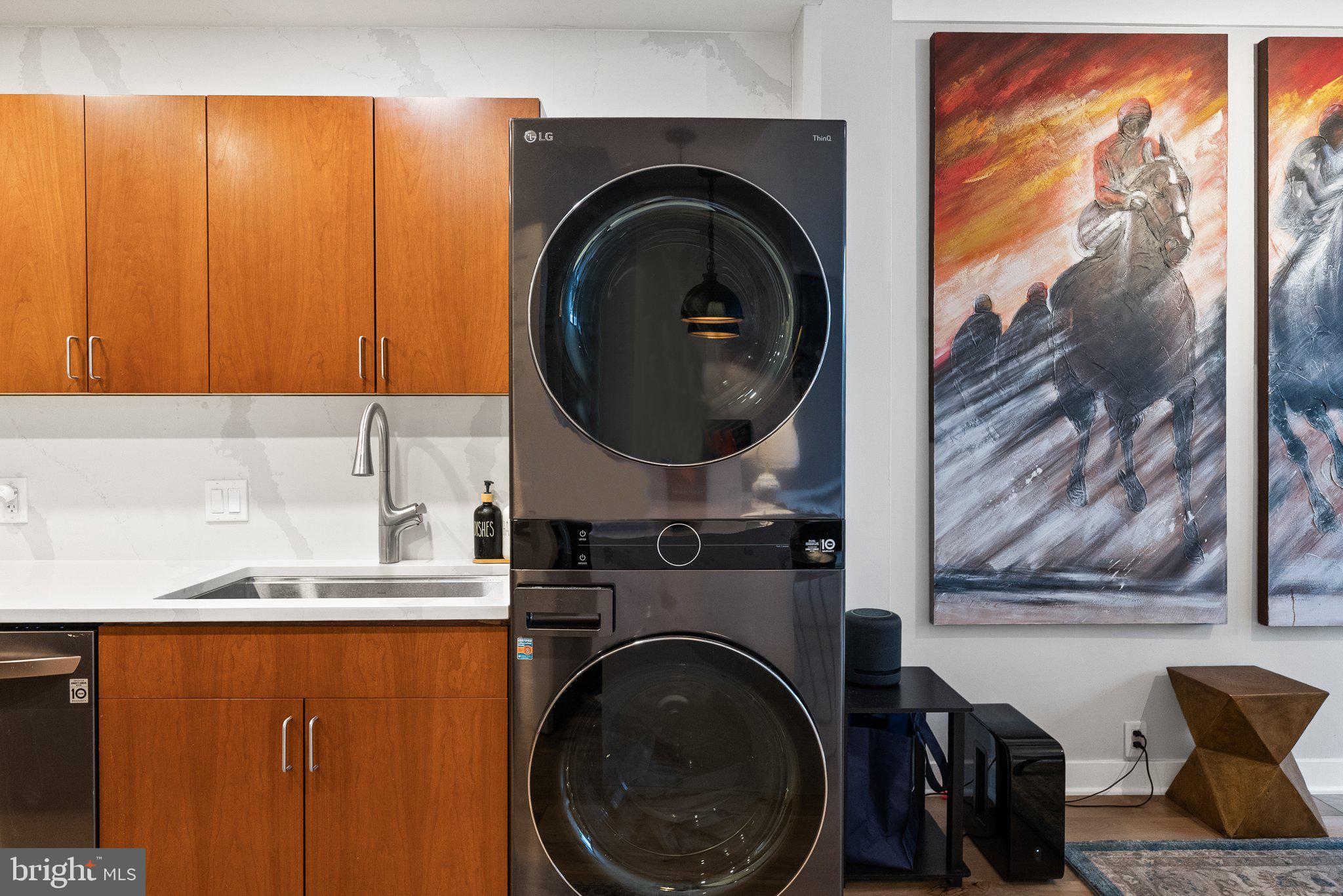 2700 Virginia Avenue Northwest, Unit 109 Washington, DC 20037 - Photo 25 of 47 a view of a living room with washer and dryer