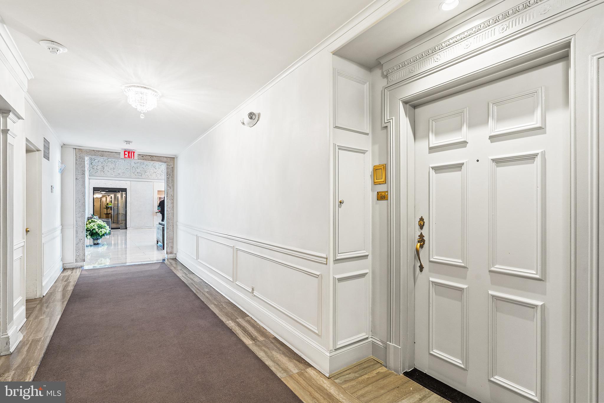2700 Virginia Avenue Northwest, Unit 109 Washington, DC 20037 - Photo 27 of 47 a view of a hallway with wooden floor and staircase