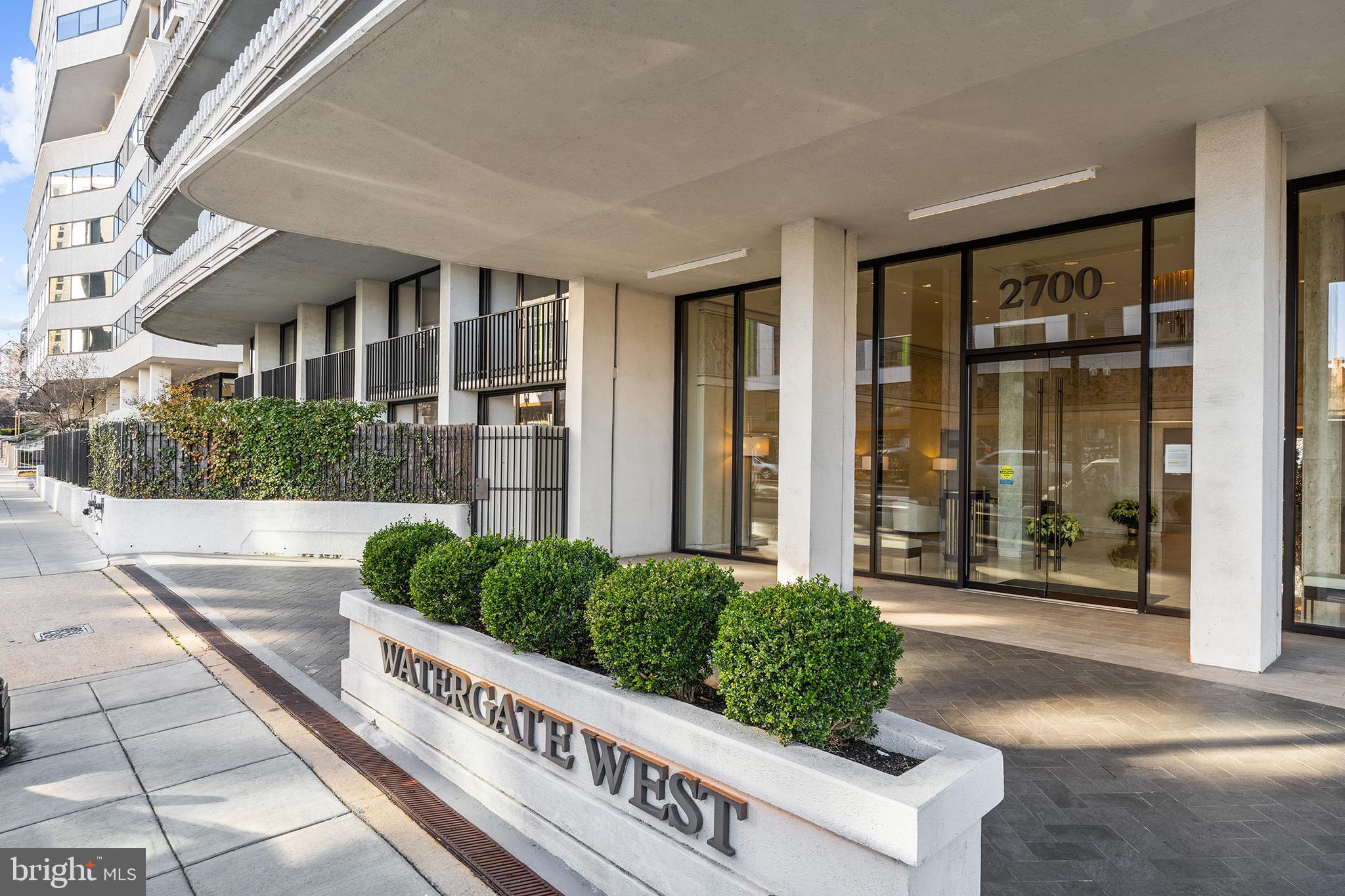 2700 Virginia Avenue Northwest, Unit 109 Washington, DC 20037 - Photo 28 of 47 a front view of a house with a yard