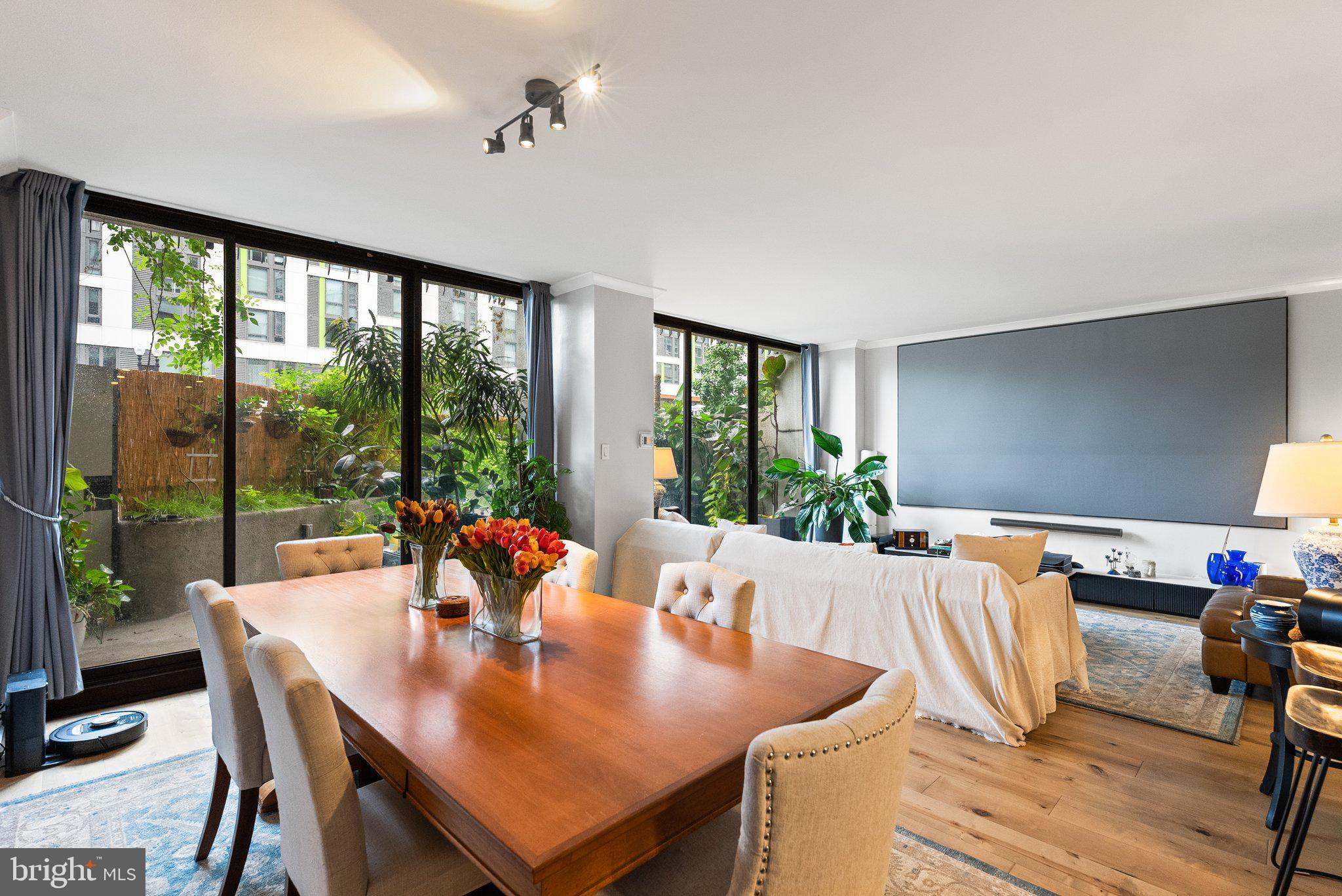 2700 Virginia Avenue Northwest, Unit 109 Washington, DC 20037 - Photo 3 of 47 a view of a dining room with furniture window and outside view