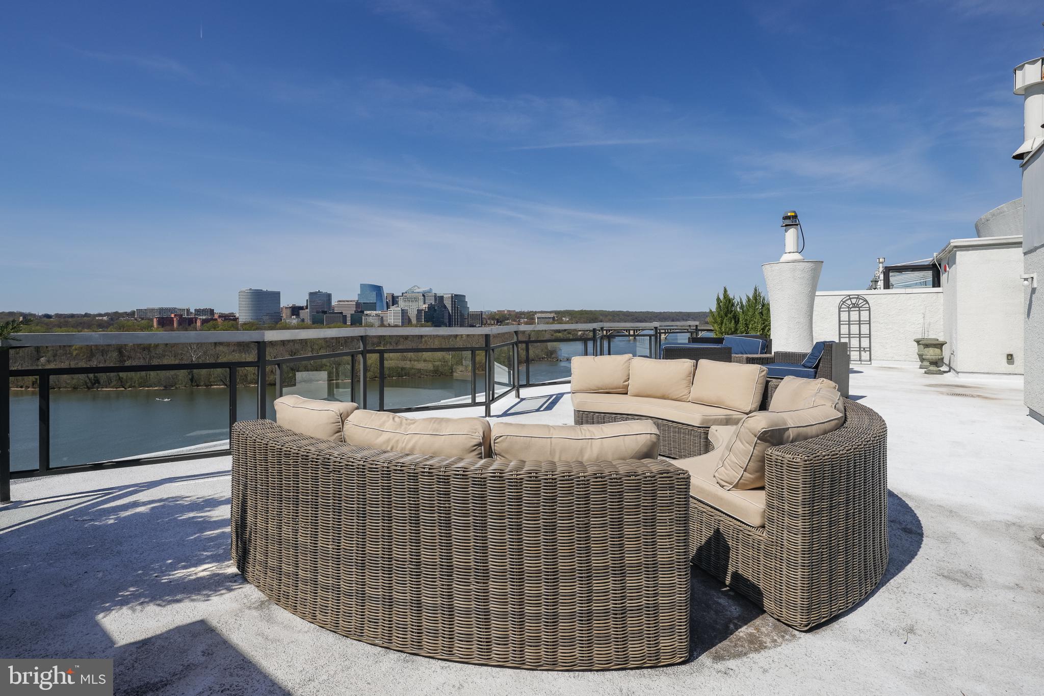 2700 Virginia Avenue Northwest, Unit 109 Washington, DC 20037 - Photo 39 of 47 a roof deck with couches and wooden floor