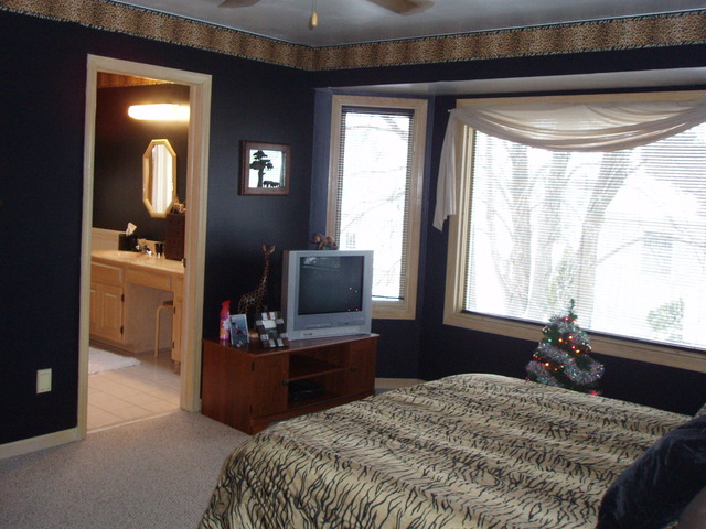 289 Butte View Drive Bolingbrook, IL 60490 - Photo 13 of 19 a bedroom with a bed and a chandelier