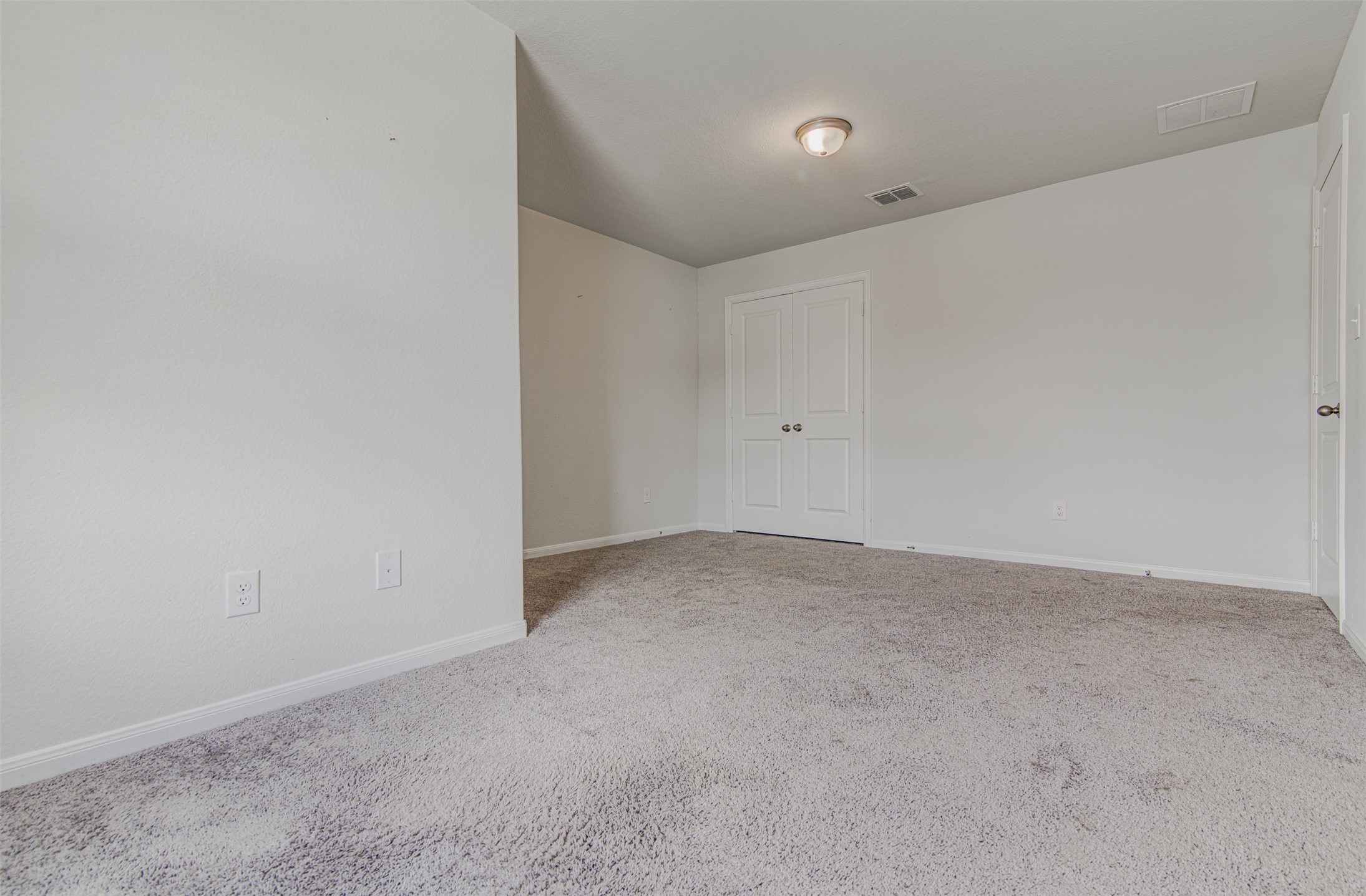 774 Cherrystone Loop Buda, TX 78610 - Photo 27 of 38 A well-maintained carpeted bedroom awaits your personal touch.