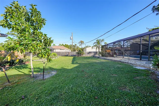 a view of yard with swimming pool