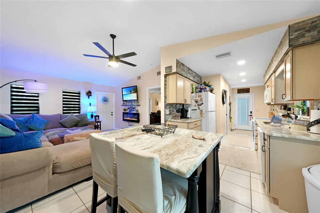 13064 Feldman Avenue Port Charlotte, FL 33981 - Photo 3 of 13 a view of a dining room with furniture