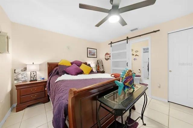 a bedroom with a bed and a table in it