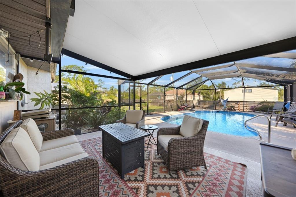 13064 Feldman Avenue Port Charlotte, FL 33981 - Photo 9 of 13 a balcony with furniture and outdoor view