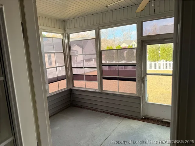 a view of empty room with windows
