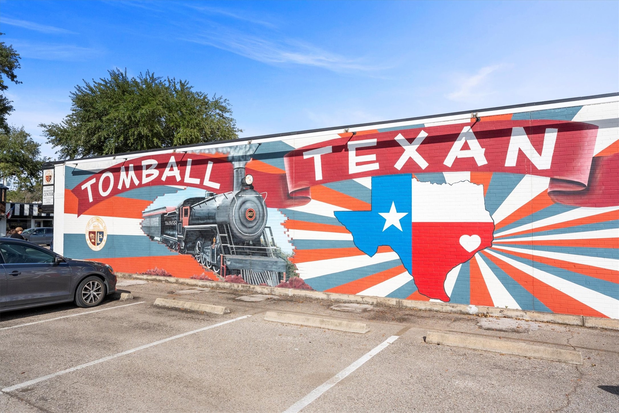 104 Anna Street Tomball, TX 77375 - Photo 28 of 32 Vibrant mural showcasing the pride of Tomball's rich history with a vintage train and the Texas state outline with Tomball at the heart. This mural is located just one mile from this home. You could literally walk there and enjoy all the festivities offered by the City of Tomball.