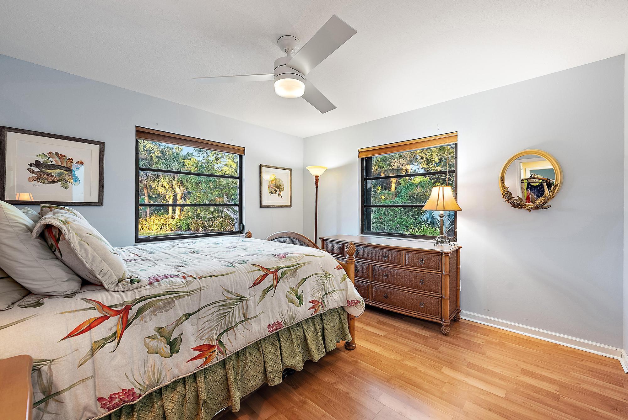 934 Penn Trail Jupiter, FL 33458 - Photo 4 of 54 a bedroom with a bed and a window