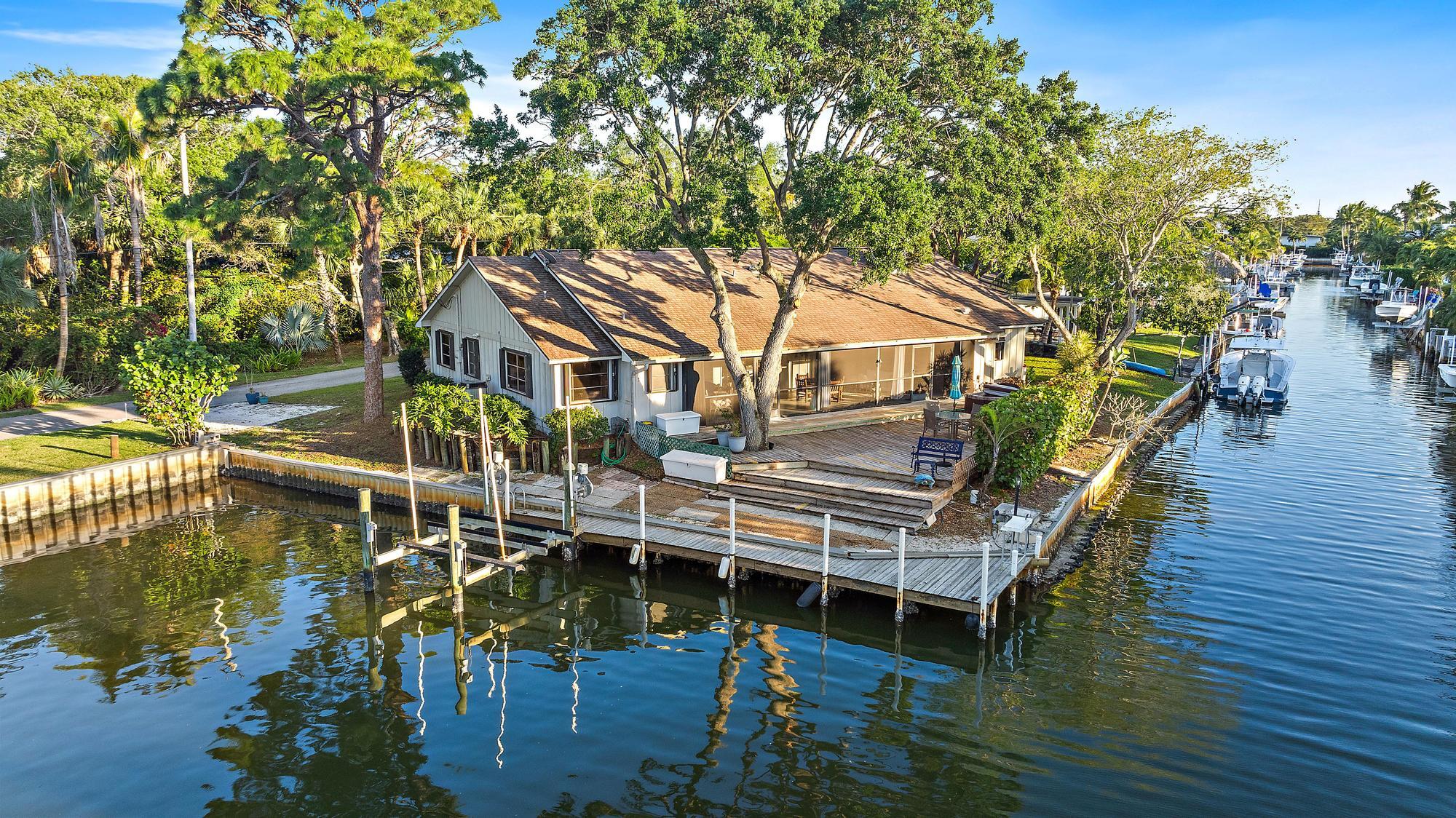 934 Penn Trail Jupiter, FL 33458 - Photo 53 of 54 a balcony with wooden floors and trees