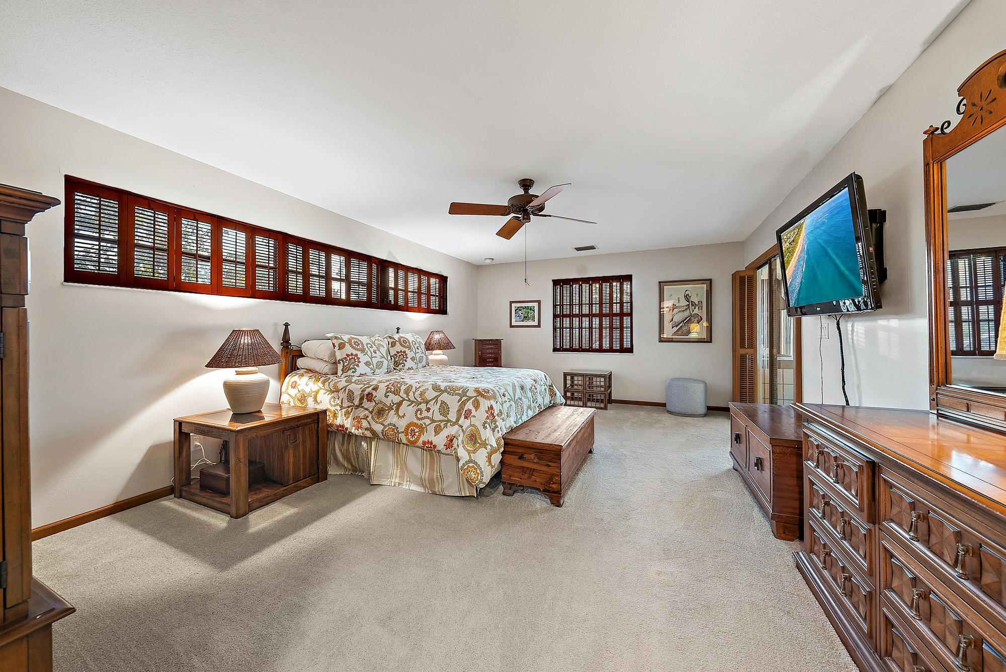 934 Penn Trail Jupiter, FL 33458 - Photo 54 of 54 a bed room with furniture and a flat screen tv