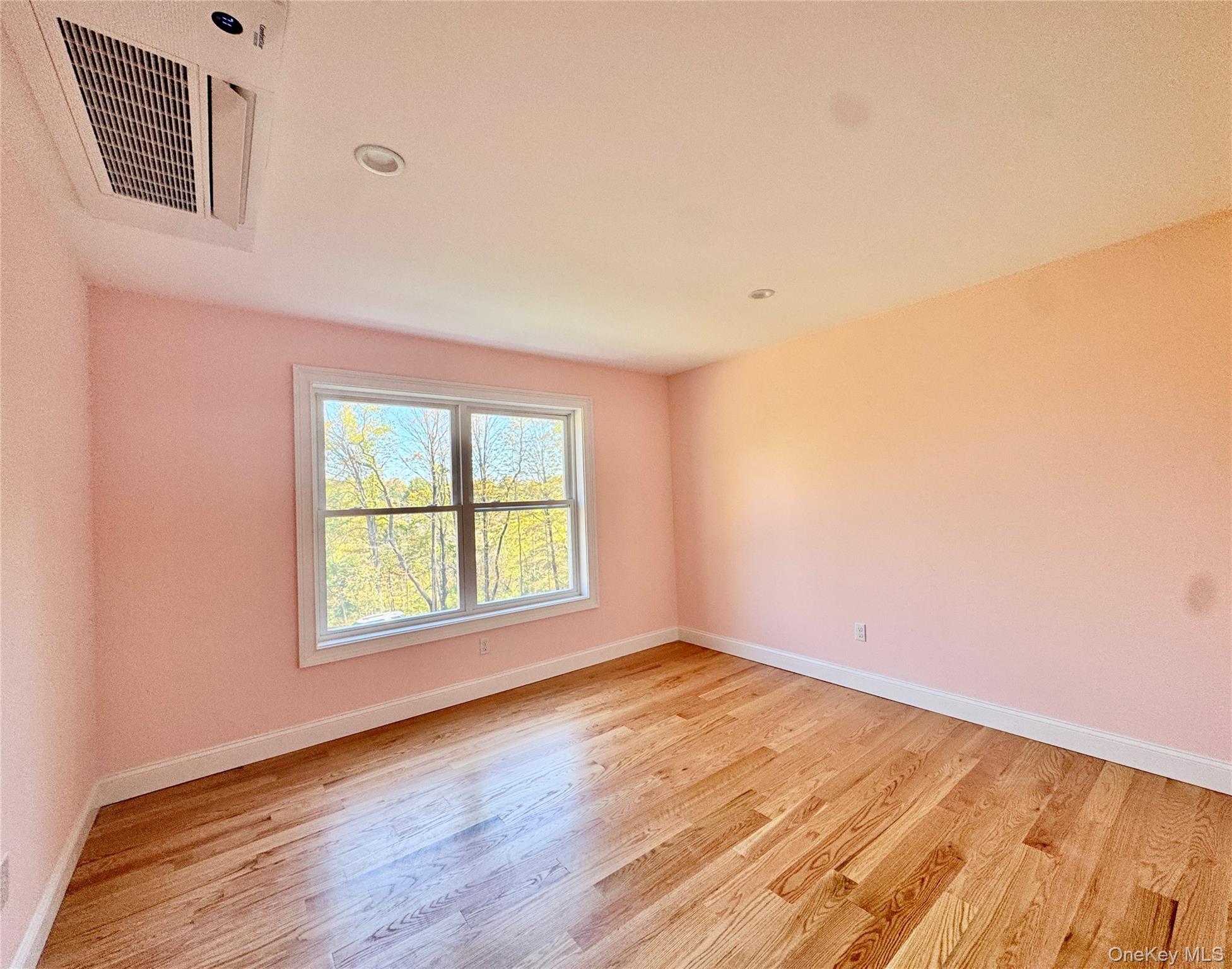 4 Webster Place Patterson, NY 12563 - Photo 12 of 42 an empty room with wooden floor and windows