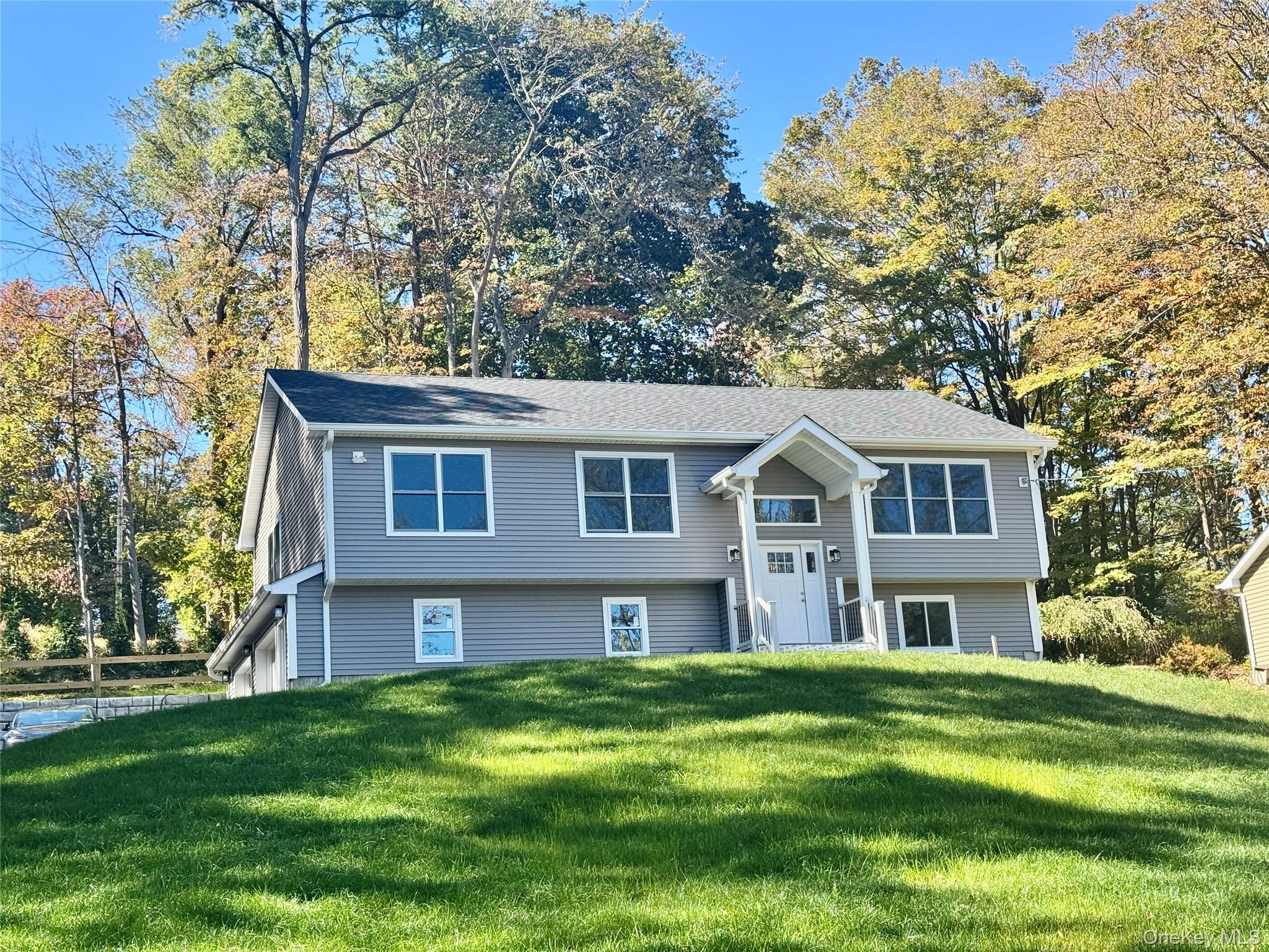 4 Webster Place Patterson, NY 12563 - Photo 2 of 42 a front view of a house with a garden