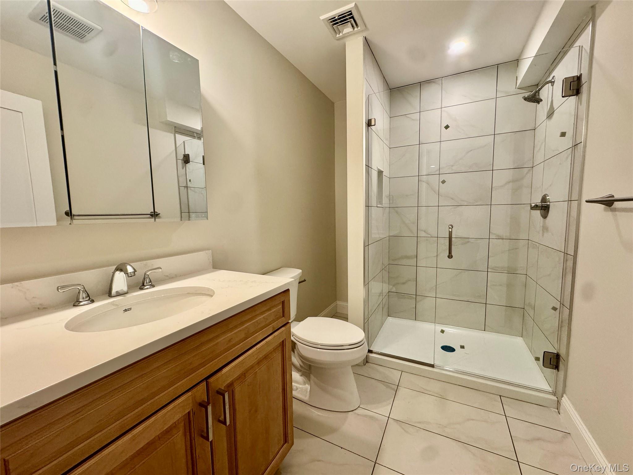 4 Webster Place Patterson, NY 12563 - Photo 24 of 42 a bathroom with a sink a toilet and shower