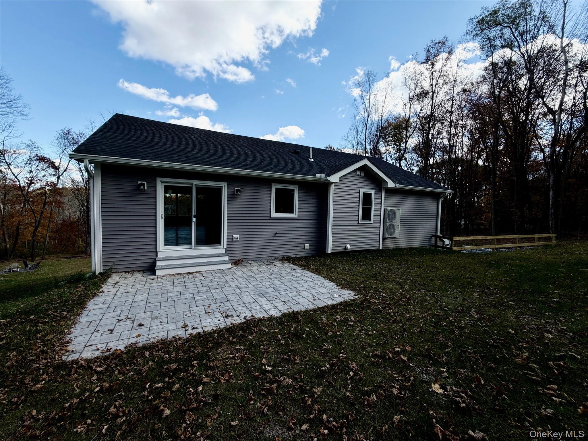 4 Webster Place Patterson, NY 12563 - Photo 30 of 42 a front view of a house with a garden and yard