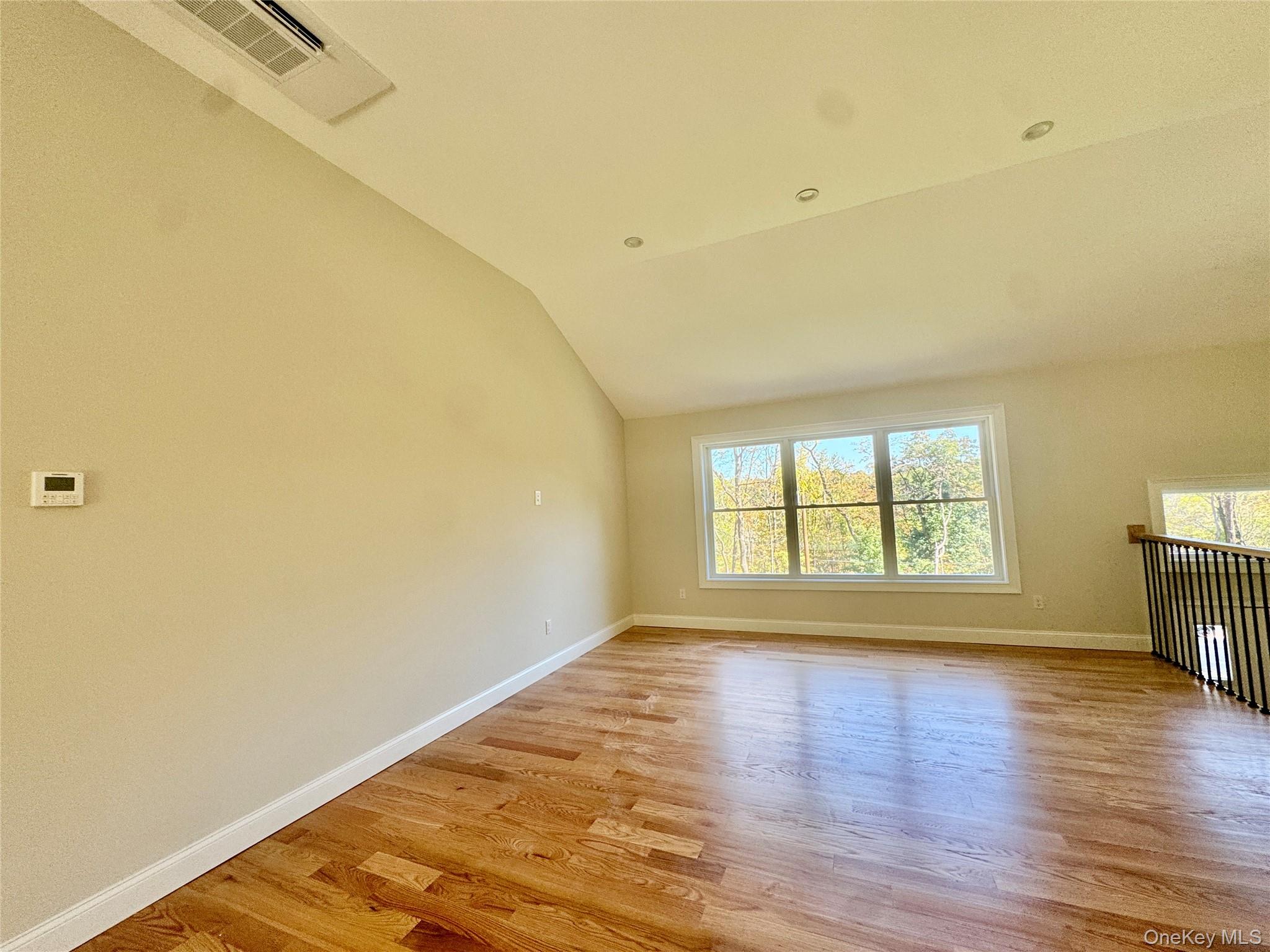 4 Webster Place Patterson, NY 12563 - Photo 6 of 42 an empty room with wooden floor and windows