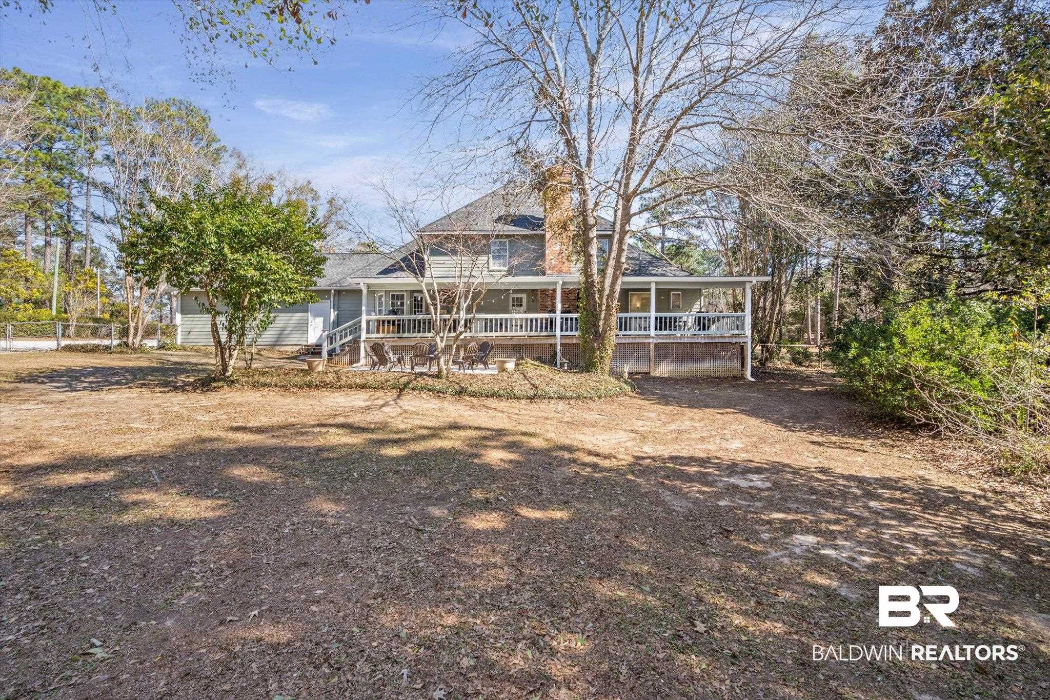 31369 Blakeley Way Daphne, AL 36527 - Photo 20 of 38 Rear view of property featuring covered porch