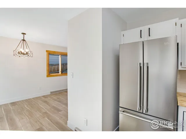 a view of a kitchen with wooden floor