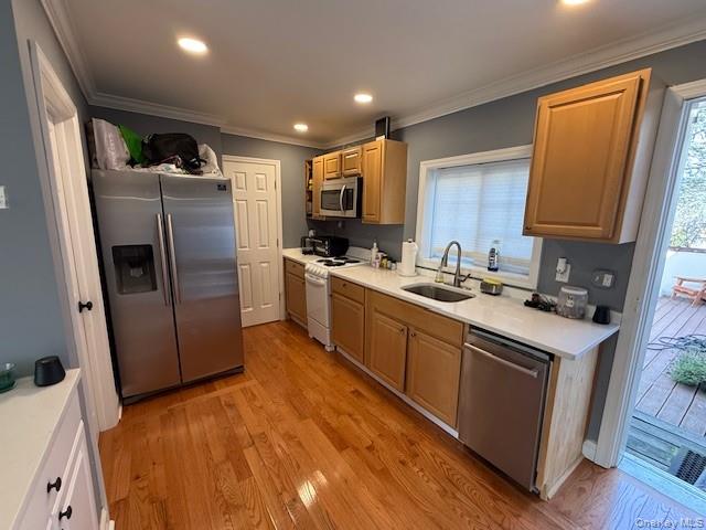 3 Union Place, Unit B Huntington, NY 11743 - Photo 10 of 15 a kitchen with stainless steel appliances granite countertop a refrigerator a sink a stove a washer dryer and a refrigerator