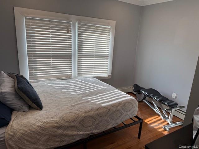 3 Union Place, Unit B Huntington, NY 11743 - Photo 11 of 15 a bedroom with a bed and a window