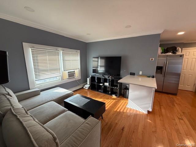 3 Union Place, Unit B Huntington, NY 11743 - Photo 2 of 15 a living room with furniture and a flat screen tv