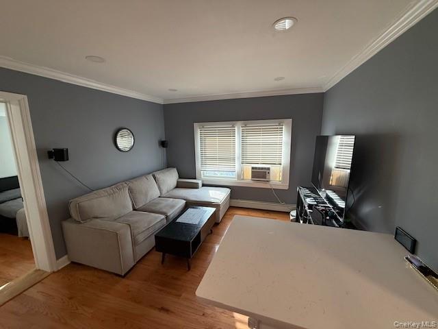 3 Union Place, Unit B Huntington, NY 11743 - Photo 3 of 15 a living room with furniture and a flat screen tv
