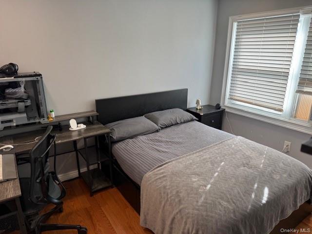 3 Union Place, Unit B Huntington, NY 11743 - Photo 5 of 15 a bedroom with a bed and a window