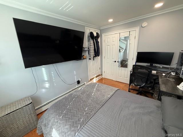 3 Union Place, Unit B Huntington, NY 11743 - Photo 6 of 15 a bedroom with a bed and a flat screen tv