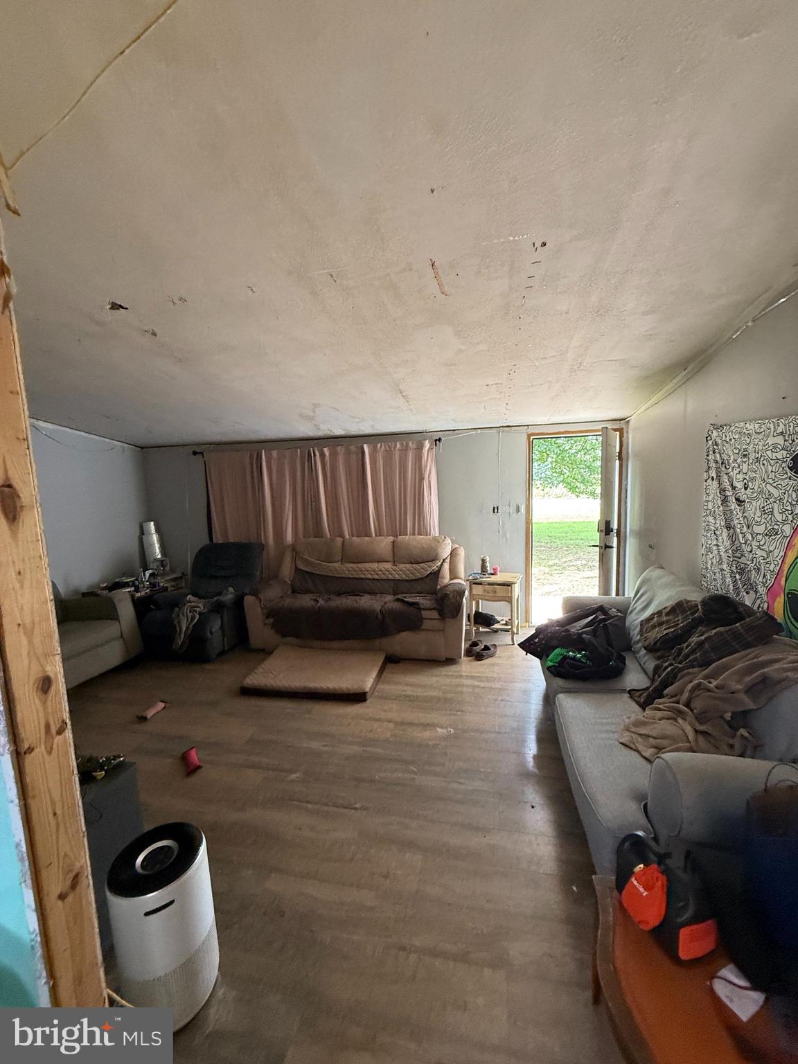 2418 Seeneytown Road Dover, DE 19904 - Photo 17 of 20 a living room with furniture and a couch