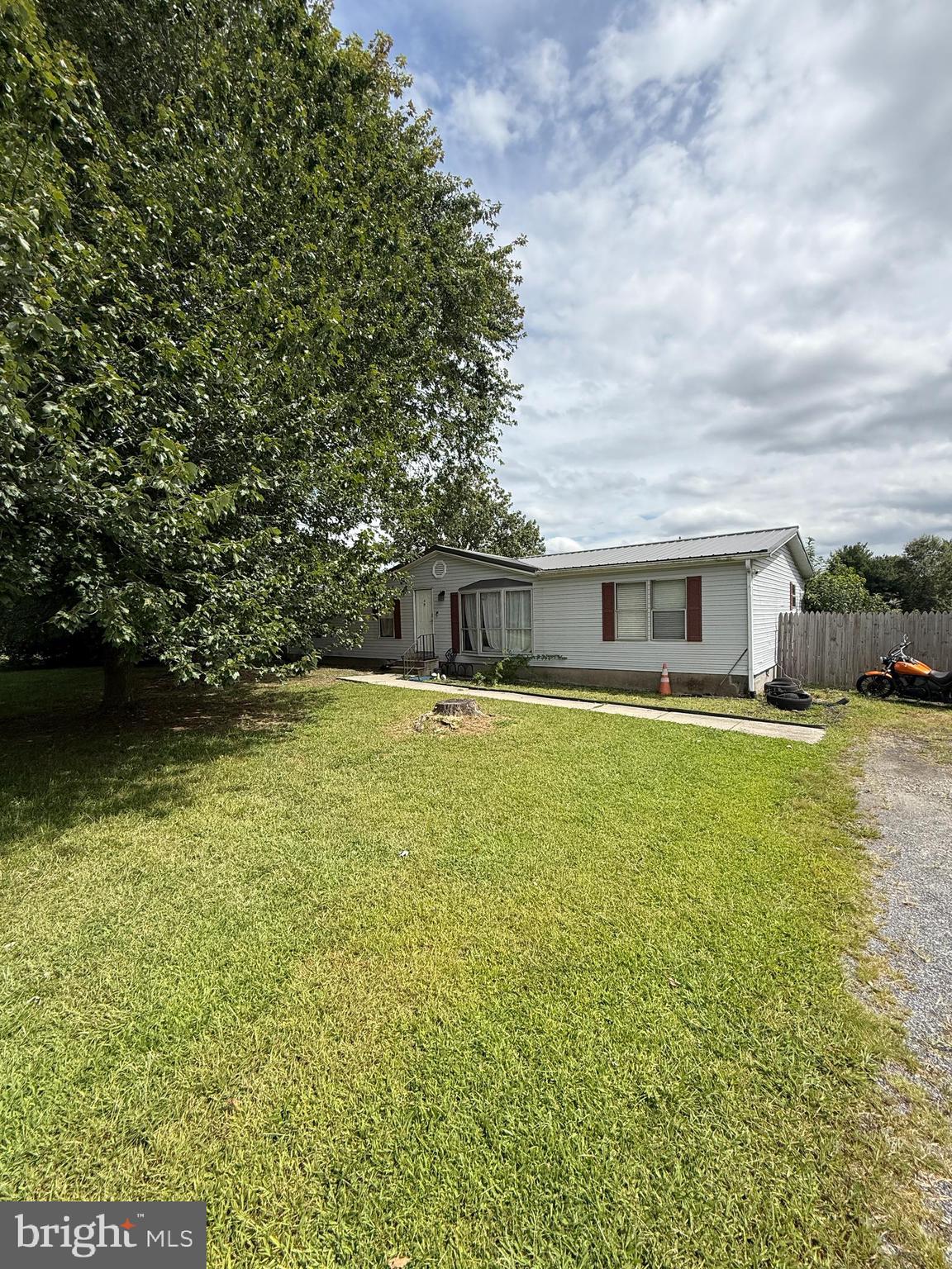 2418 Seeneytown Road Dover, DE 19904 - Photo 8 of 20 a front view of a house with a yard