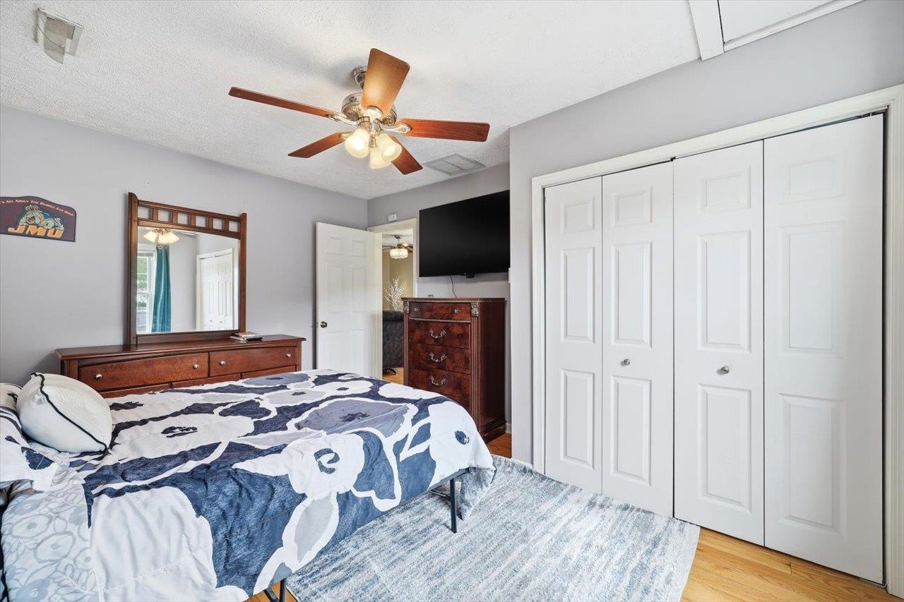 1296 New Hope Road Staunton, VA 24401 - Photo 11 of 37 a bedroom with a bed and a flat screen tv