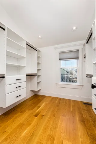 a room with a bed and a window